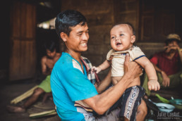 Father and son in a village around Luang Prabang