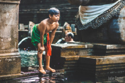 Young boy at Tirta Empul Tampak Siring - Bali Holy Spring Water Temple